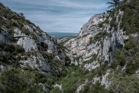 Walking down a canyon surrounded by cliffs in Luberon Stock Photos