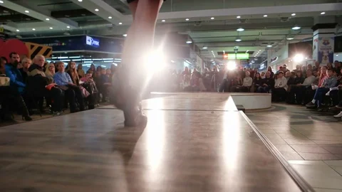 Walking down catwalk, female legs defile on podium closeup, fashion show, model Stock Footage
