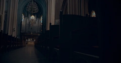 Walking down the church aisle, slow motion along the church benches. Cold colors Stock Footage
