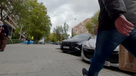 Walking down the city sidewalk Stock Footage 221354375