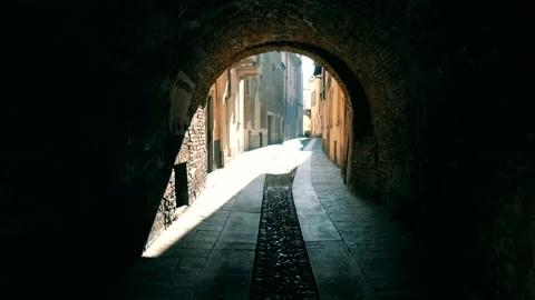 Walking Down Classic Narrow Street into Sunlight in Small Italian Village 4K Stock Footage 199628243