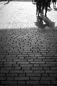 Walking down a cobbled lane Stock Photos