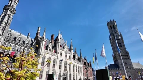 Walking down a cobblestone street lined with magnificent Gothic facades in Bruge Vidéo 333202714
