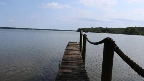 Walking Down Dock on the River Stock Footage 138122895