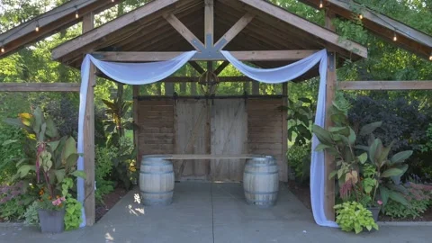 Walking down empty wedding aisle in Summer with sun beaming through trees Stock Footage 254010696