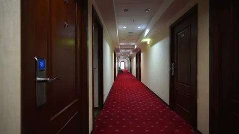 Walking down hotel corridor and opening room door with electronic lock Stock Footage 105669745