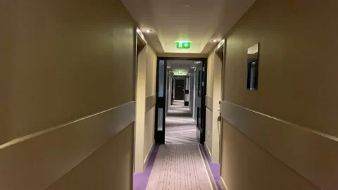 Walking down a hotel corridor Stock Footage 178650664