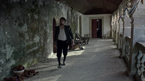 Walking down a long corridor in an old building at sunset Stock Footage 327966653