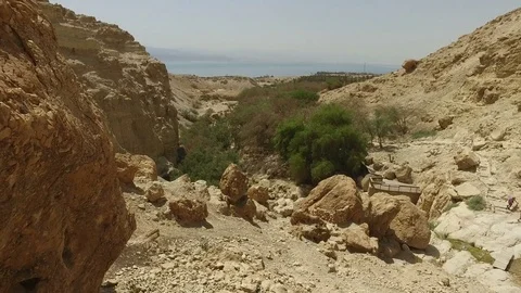 Walking Down Mountainous Path in Desert Stock Footage 77879326