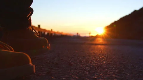 Walking Down Mountian Road into Sunset. Close Up Shoes Stock Footage