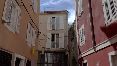 Walking down a narrow empty street, old medieval seaside town Piran, Slovenia Stock Footage 158222925