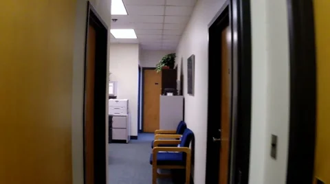 Walking down  narrow office corridor POV Stock Footage 46936271
