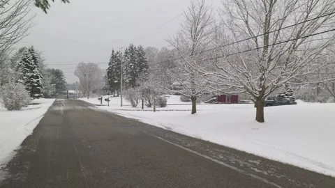 Walking down a normal New Hampshire neighborhood road after a snow storm. It is Stock-Footage 328732958