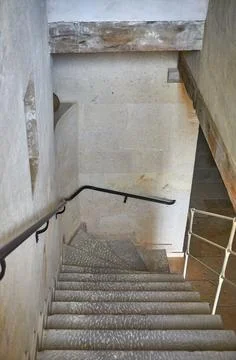 Walking down the old style stone stairs Foto stock