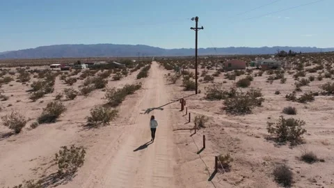 Walking Down Open Desert Road Stock Footage 146146848
