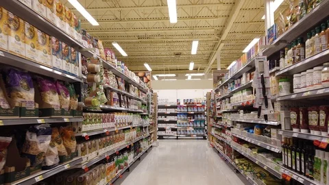 Walking Down Organic Food Section Aisle Of Grocery Store Stock Footage