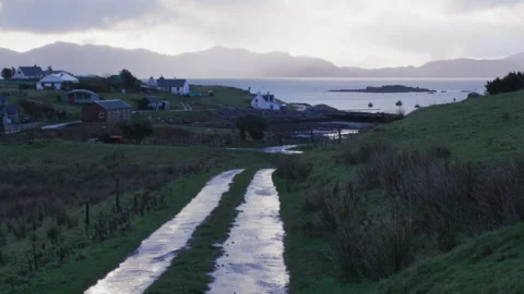 Walking down a quiet path by the water in a coastal area Stock Footage 325808927