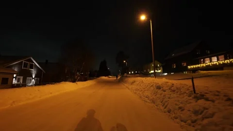Walking down residential road at night in Tromso, Norway Stock Footage 301551892