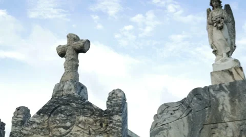 Walking down a row of angels and crosses on top of tombs Stock Footage 58409157