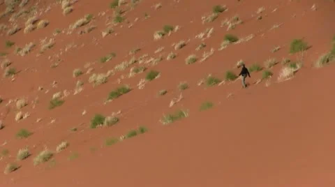 Walking down a sand dune Video stock 12148498