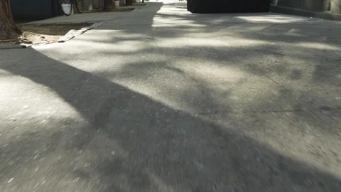 Walking down a shadow and sun New York city Manhattan sidwalk Stock Footage 242312579