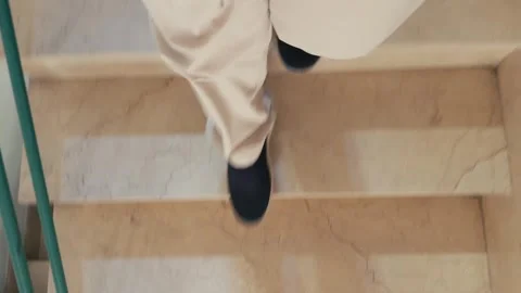 Walking Down Staircase Shoes And White Pants Top-Down Perspective On Steps Stock Footage 346765085