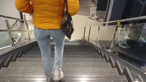 Walking down the stairs Stock Footage 262095838