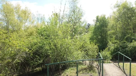 Walking down the steps from the rail bridge to Crown Lakes 库存影片 333266271