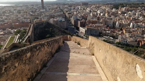 Walking down on stone wall towards Alicante centrum, Santa Barbara Castle Stock Footage 229619643