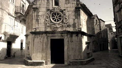 Walking down the street of an old town on Hvar, Croatia. Old film effect. Stock Footage 44562463