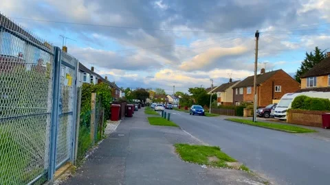 Walking down a suburban street in Reading, UK Stock Footage 240868835