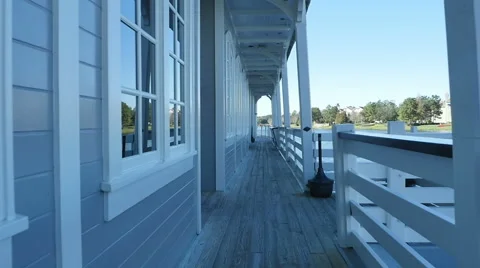 Walking Down Walkway in Slow Motion Next to Water Stock Footage 61532591