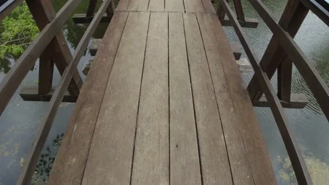 Walking down the wooden bridge Stock Footage 154619992