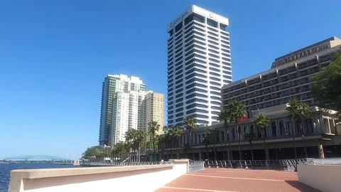 Walking by downtown river bank Stock Footage 155753191