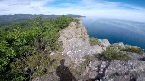 Walking on the edge Stock Footage 122890769