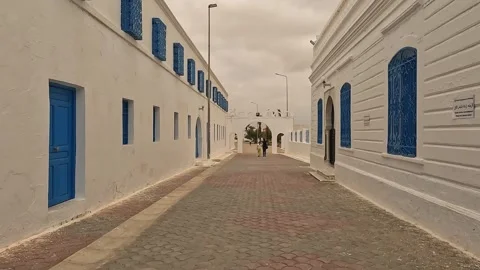 Walking in el ghriba synagogue of djerba on cloudy day Stock Footage 278924063