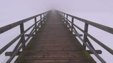 Walking on empty old wooden winter lake bridge and dark morning fog mist 스톡 동영상 45480846