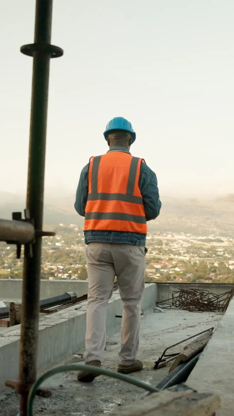 Walking, engineer and rooftop with man on construction site for thinking Stock Footage 340880367