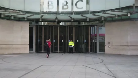 Walking into the entrance of BBC headquarters in london Stock Footage