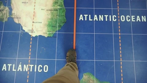 walking on equator line on the map floor | Stock Video | Pond5
