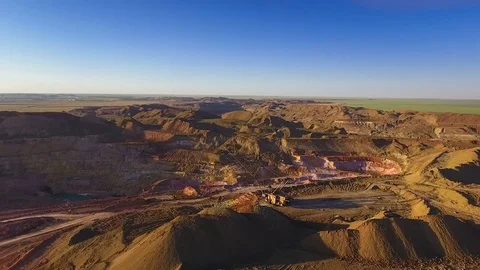 Walking excavator draws ore. Sunset. Bird's eye view 스톡 동영상 73477002