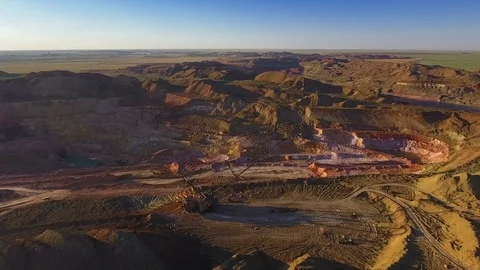 Walking excavator draws ore. Sunset. Bird's eye view 스톡 동영상 73477954