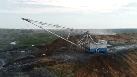 Walking excavator working at coal mine. Dragline Excavator Loads Soil, Clay Stock Footage 154337624