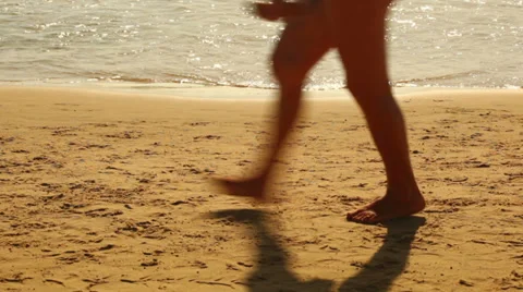 Walking feet on the beach Stock Footage 35573788