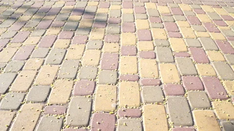 Walking feet on the cubic pavement Stock-Footage 49546677