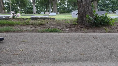 Walking feet in a graveyard Stock Footage 93622926