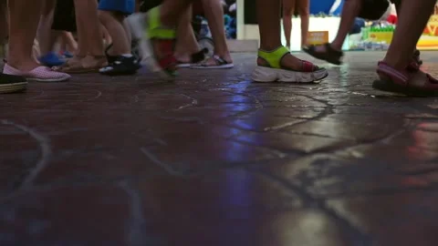 Walking feets in the stone street. Stock Footage 245480570