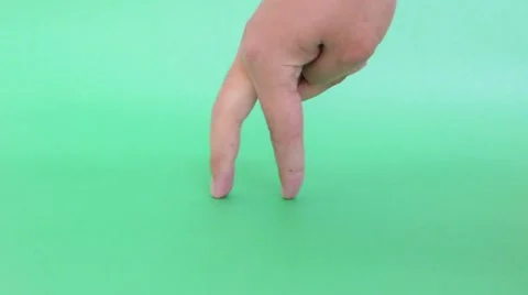 Walking fingers on green background Stock Footage 62225344