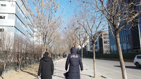 Walking on footpath sidewalk heading to working at the office Stock Footage 123096705