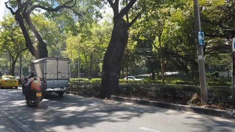 Walking on footpath Wireless road from BTS Ploenchit to CRC tower Stock Footage 123079699